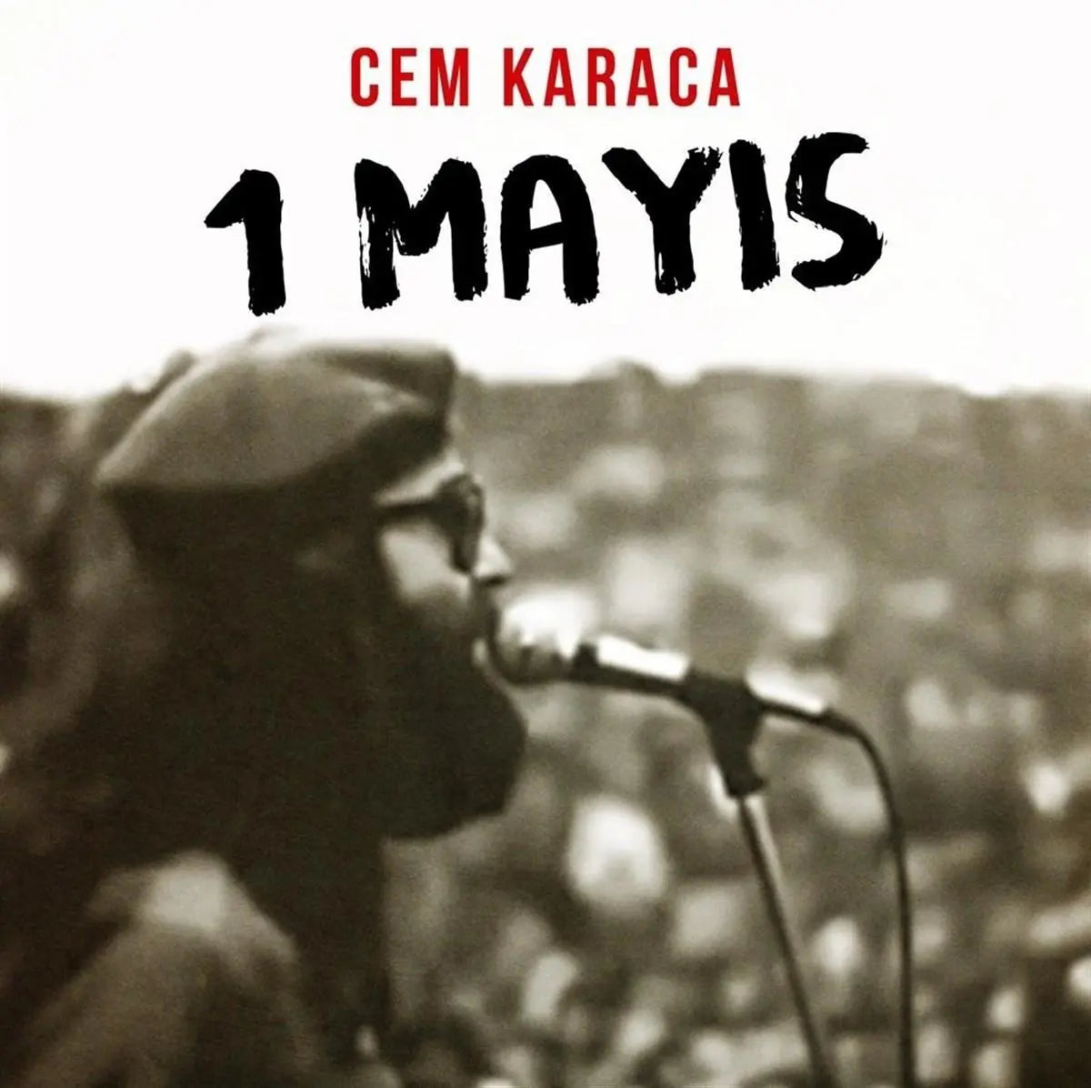Cem Karaca 1 Mayis LP album cover featuring artist singing into microphone with blurred crowd background