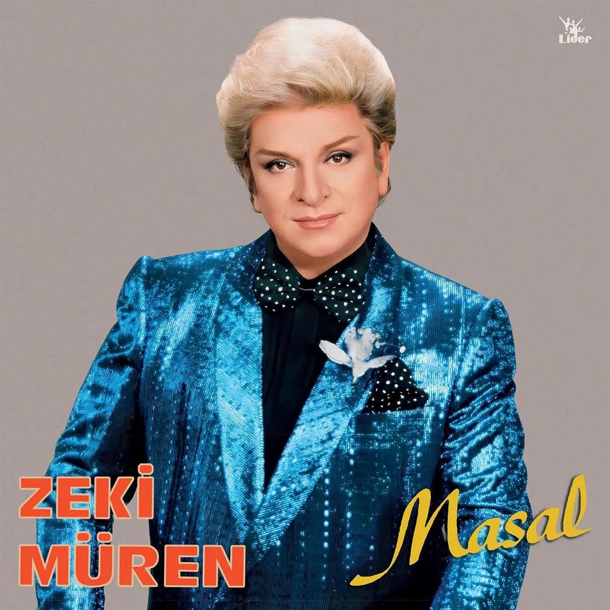 Zeki Müren wearing a shiny blue suit on the cover of Masal LP album